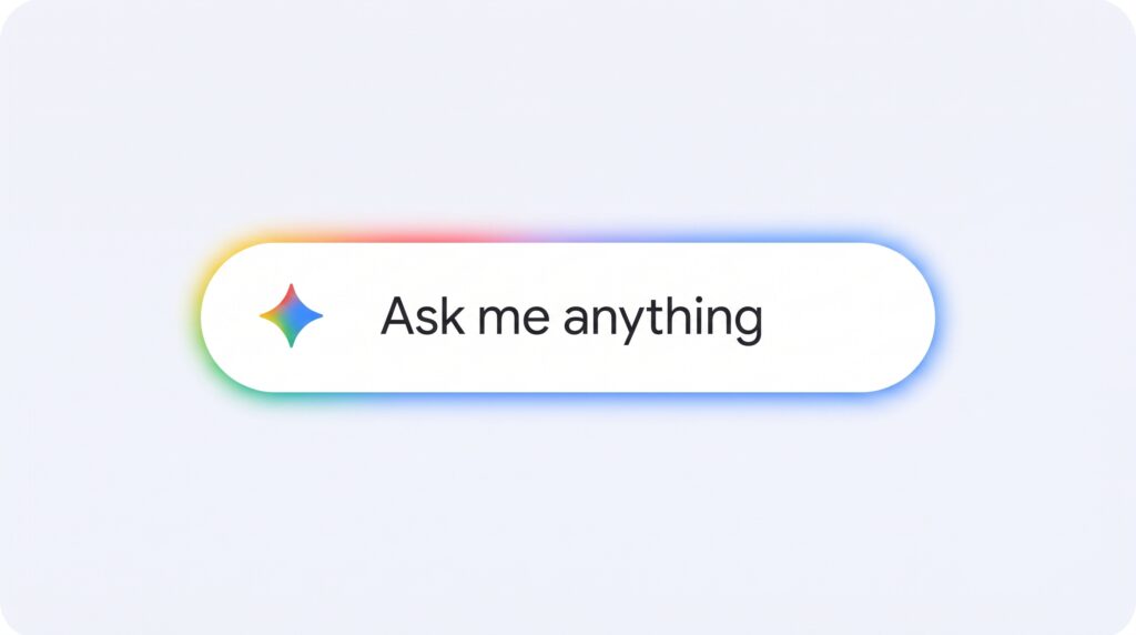 Une barre de saisie blanche sur un fond gris clair, contenant une icône d'étoile à quatre branches multicolore suivie du texte "Ask me anything". La barre est entourée d'une douce lueur ombrée aux couleurs de l'arc-en-ciel.